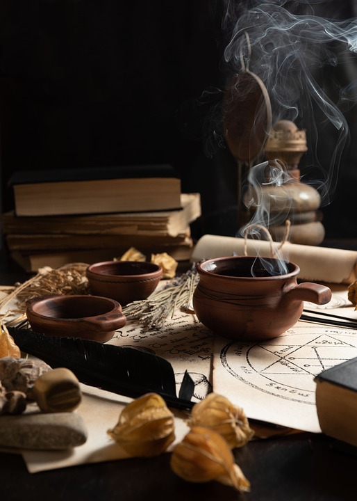 clay bowls amidst books of spells