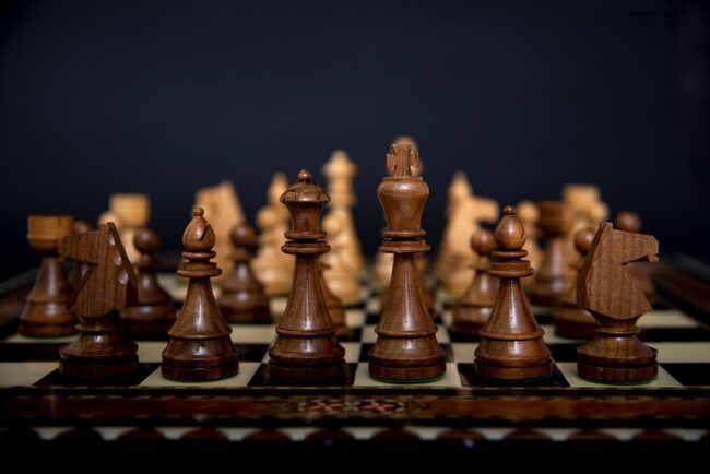 chess board with chess pieces arranged